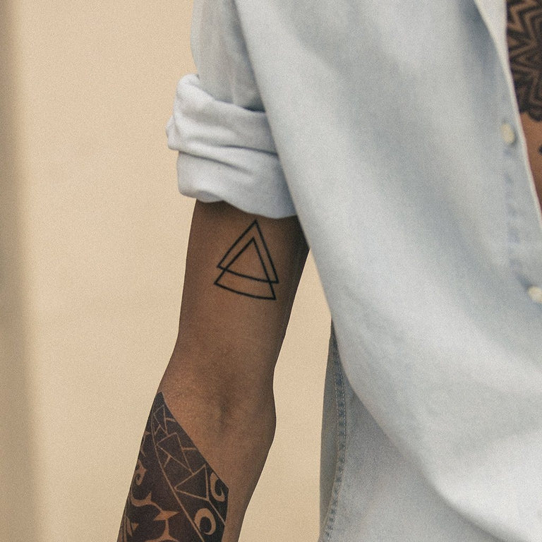 simple inner bicep tattoo of intersecting triangle | Stable Diffusion