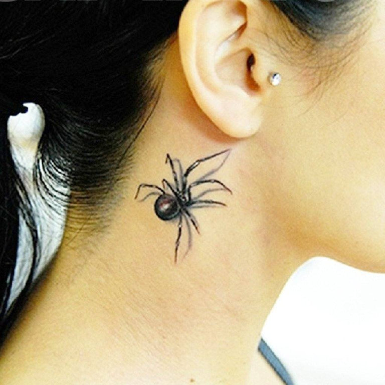 Johnnie Guilbert's spider neck tattoo