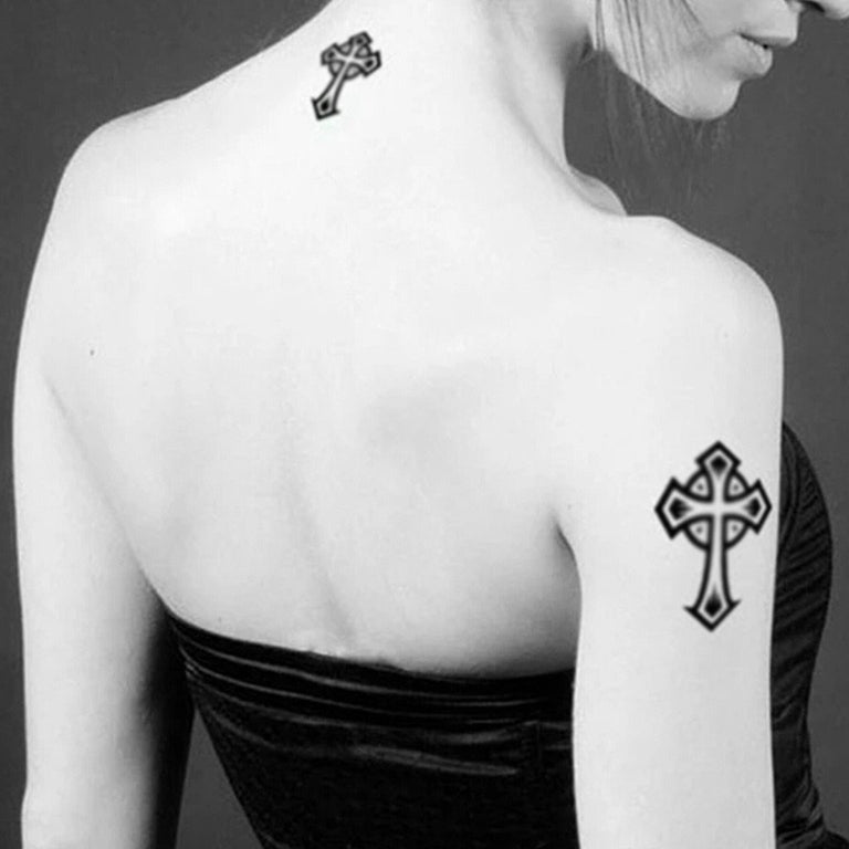 black cross tattoo on back